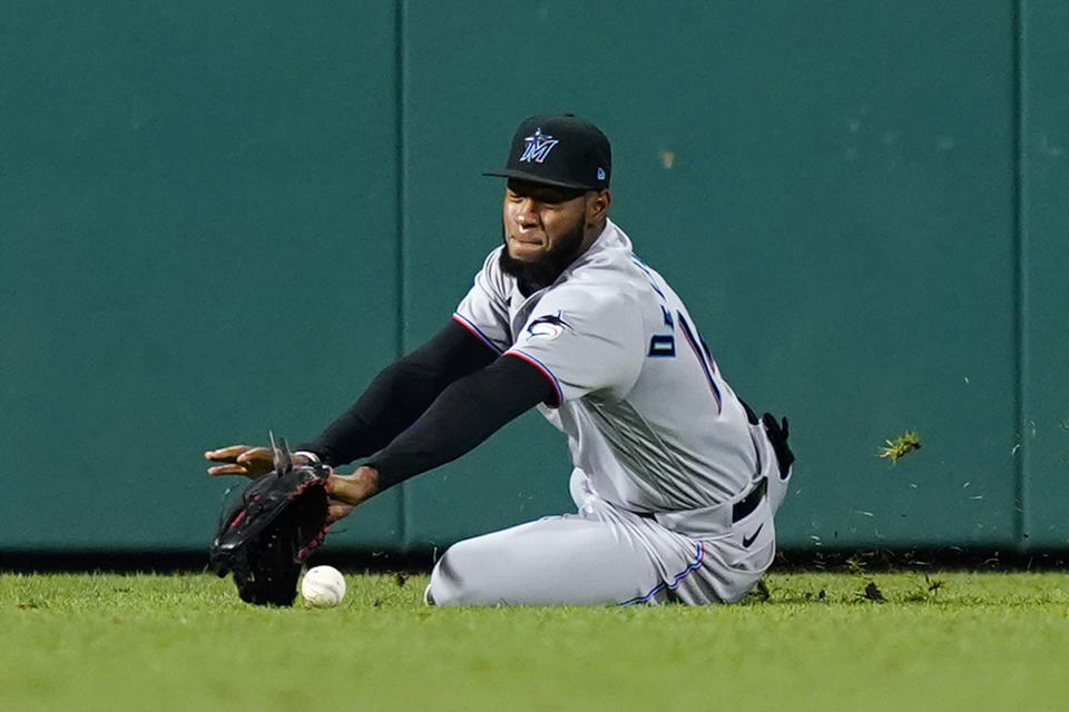 Miami Marlins left fielder Bryan De La Cruz cannot catch a single by Philadelphia Phillies' Alec Bohm during the eighth inning of a baseball game, Wednesday, Sept. 7, 2022, in Philadelphia. (AP Photo/Matt Slocum)