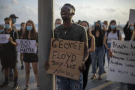 Protesters shout slogans during a protest to decry the killing of George Floyd in front of the American embassy in Tel Aviv, Israel, Tuesday, June 2, 2020. (AP Photo/Ariel Schalit)