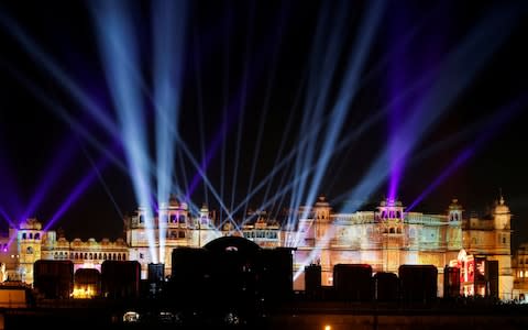 A view of the illuminated City Palace during the celebrations - Credit: REUTERS/Amit Dave 