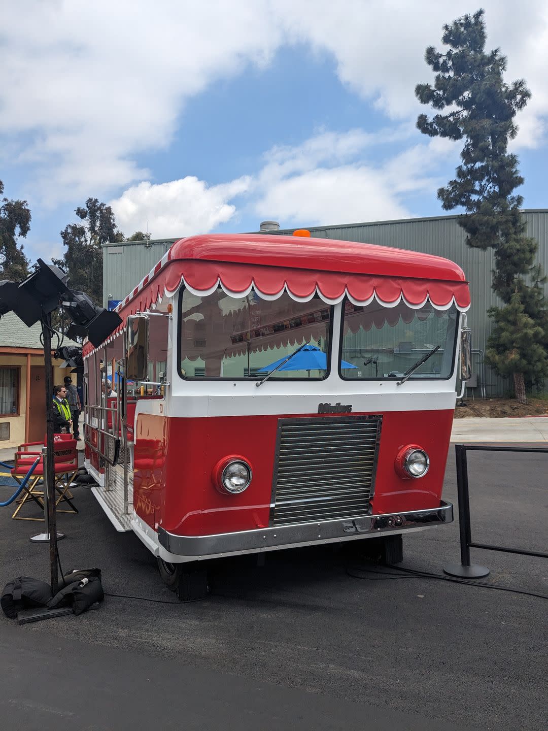 a red bus parked on the side of a road