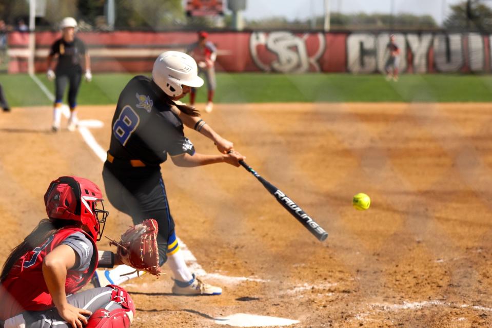 Jocelyn Carrillo of SDSU launches a grand slam home run to lift the Jacks to a win over USD on Saturday in Vermillion