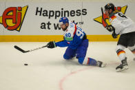 Slovakia's Tomas Tatar, left, challenges for a puck with Germany's Leonhard Pfoderl during the preliminary round match between Slovakia and Germany at the Ice Hockey World Championships in Ostrava, Czech Republic, Friday, May 10, 2024. (AP Photo/Darko Vojinovic)