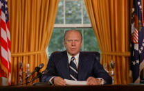 <p>President Gerald Ford reads a proclamation in the White House on Sept. 8, 1974, granting former president Richard Nixon “a full, free and absolute pardon” for all “offenses against the United States” during the period of his presidency. (Photo: AP) </p>