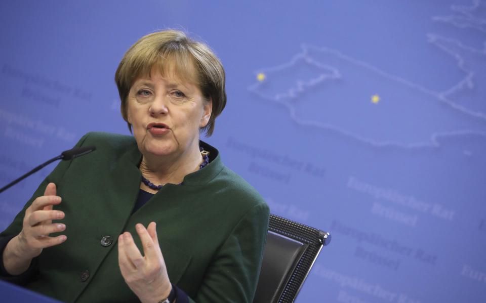 FILE - In this March 10, 2017 file photo, German Chancellor Angela Merkel speaks in Brussels. President Trump will have his first face-to-face meeting with the German leader at the White House on Tuesday, March 14, 2017. (AP Photo/Olivier Matthys, File)