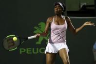 Mar 27, 2017; Miami, FL, USA; Venus Williams of the United States hits a forehand against Svetlana Kuznetsova of Russia (not pictured) on day seven of the 2017 Miami Open at Crandon Park Tennis Center. Williams won 6-3, 7-6(4). Mandatory Credit: Geoff Burke-USA TODAY Sports