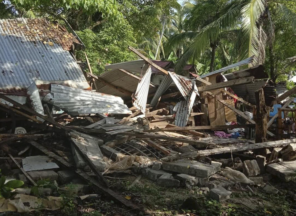 In this photo provided by the Philippine Red Cross, a toppled house is seen after a quake struck in Cataingan, Masbate province, central Philippines on Tuesday Aug. 18, 2020. A powerful and shallow earthquake struck a central Philippine region Tuesday, prompting people to dash out of homes and offices but there were no immediate reports of injuries or major damage. (John Mark Lalaguna/Philippine National Red Cross via AP)