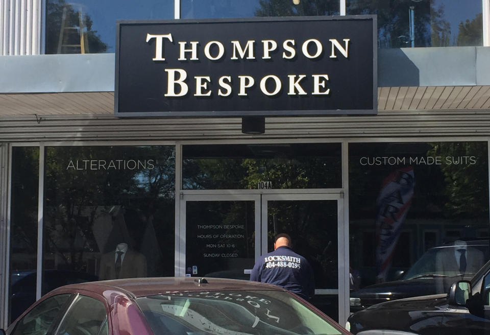 A locksmith tries to gain entry to the Thompson Bespoke clothing store at Rashan Michel’s behest. (Yahoo Sports)