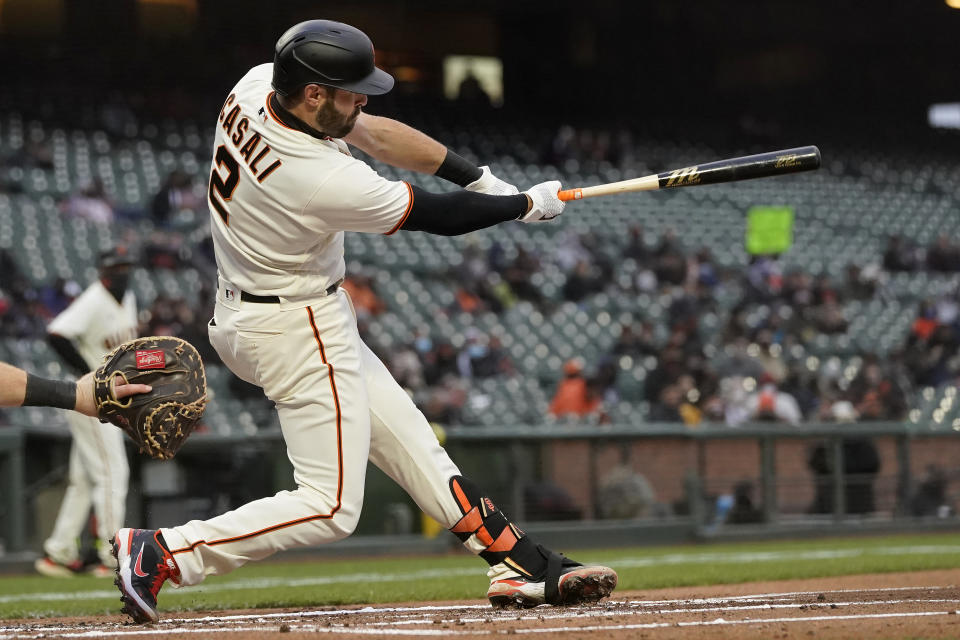 San Francisco Giants' Curt Casali hits a two-run single against the Miami Marlins during the first inning of a baseball game in San Francisco, Calif., Thursday, April 22, 2021. (AP Photo/Jeff Chiu)