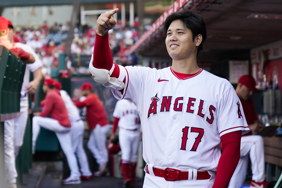 Los Angeles Angels designated hitter Shohei Ohtani (17) greets a teammate in the dugout during the first inning of a baseball game against the Arizona Diamondbacks in Anaheim, Calif., Friday, June 30, 2023. (AP Photo/Ashley Landis)