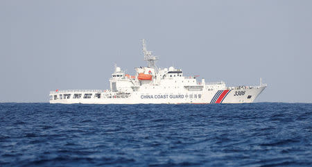 A China Coast Guard vessel patrols at the disputed Scarborough Shoal April 5, 2017. Picture taken April 5, 2017. REUTERS/Erik De Castro