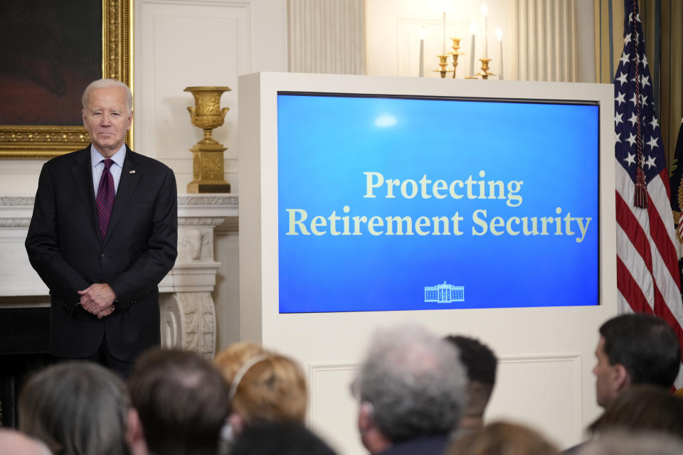 President Joe Biden listens before speaking during an event for protecting retirement security. 