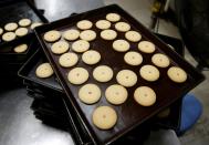 A batch of freshly baked cookies rests on a tray at Izumiya Tokyoten's factory in Kawasaki