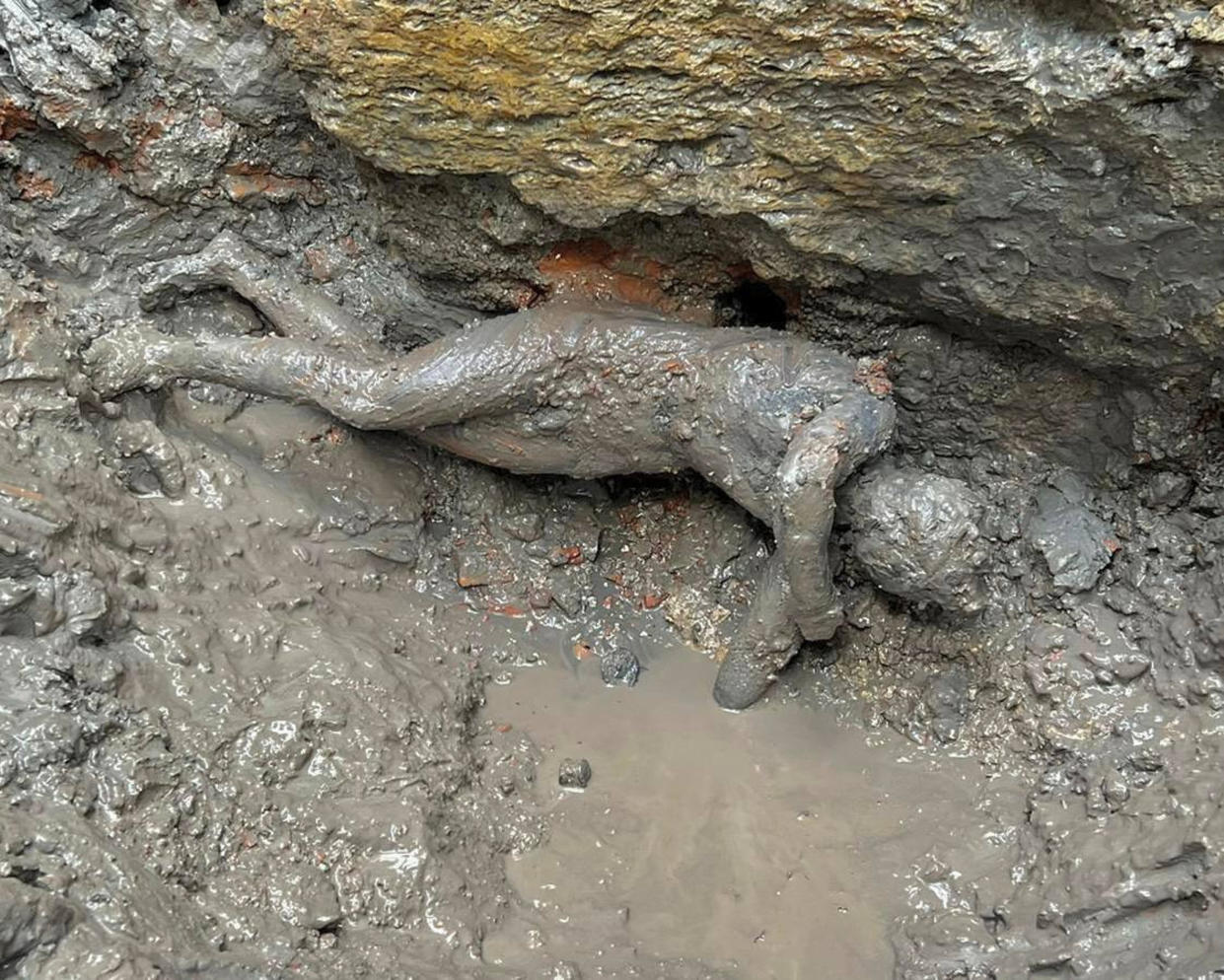 A statue is seen at the site of the discovery of two dozen well-preserved bronze statues from an ancient Tuscan thermal spring in San Casciano dei Bagni, central Italy, in this undated photo made available by the Italian Culture Ministry, Thursday, Nov. 3, 2022. (Italian Culture Ministry via AP)