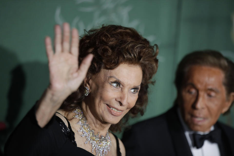 Actress Sophia Loren, left, and designer Valentino Garavani pose for photographers upon arrival at the Green Carpet Fashion Awards in Milan, Italy, Sunday, Sept. 22, 2019. (AP Photo/Luca Bruno)