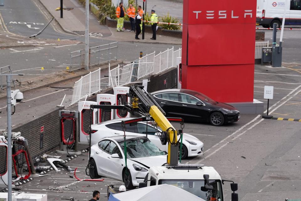 A car is removed from the Tesla Centre in Park Royal (REUTERS)