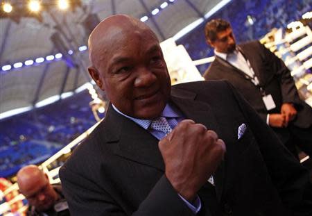 Former heavyweight champion George Foreman gestures before the heavyweight title unification boxing match between Ukrainian IBF and WBO titleholder Vladimir Klitschko against British WBA champion David Haye in Hamburg July 2, 2011. REUTERS/Kai Pfaffenbach