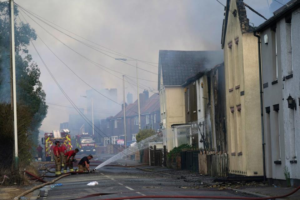 Firefighters at the scene of a blaze in the village of Wennington, east London (PA)