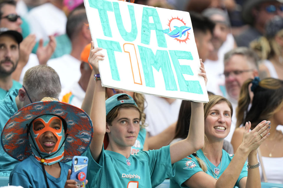 Miami Dolphins fans cheer the team during the first half of an NFL football game against the Cleveland Browns, Sunday, Nov. 13, 2022, in Miami Gardens, Fla. (AP Photo/Wilfredo Lee)