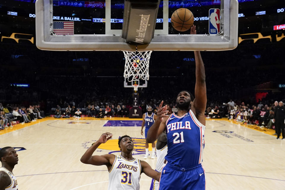 Philadelphia 76ers center Joel Embiid (21) shoots against Los Angeles Lakers center Thomas Bryant (31) during the first half of an NBA basketball game in Los Angeles, Sunday, Jan. 15, 2023. (AP Photo/Ashley Landis)