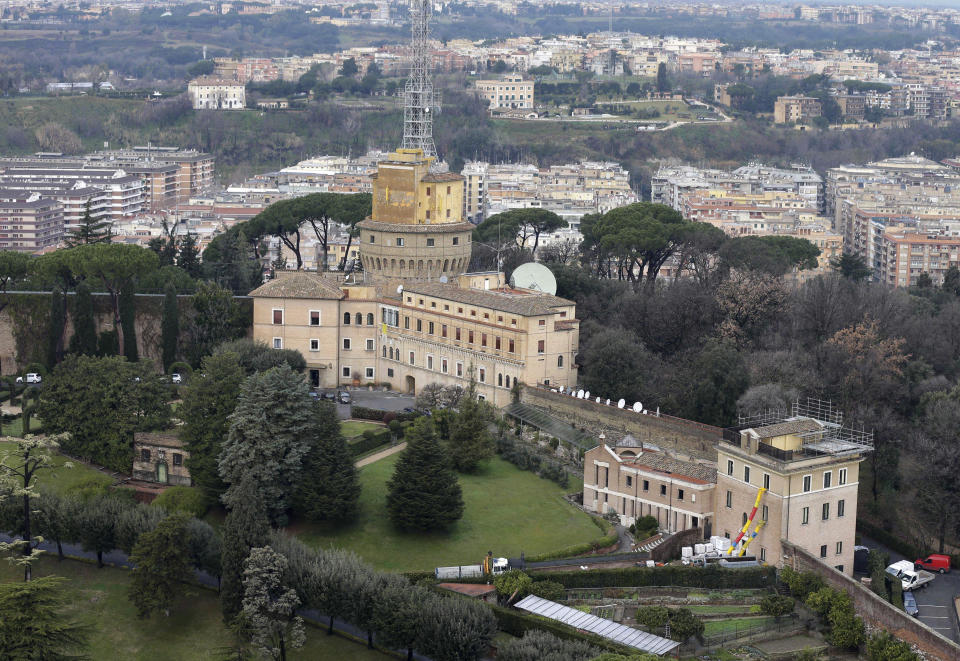 FILE - The Mater Ecclesiae Monastery, right, next to the Tower of San Giovanni, inside the Vatican State, on Feb. 12, 2013, where Pope Benedict XVI is expected to live after he resigns. Pope Benedict XVI’s 2013 resignation sparked calls for rules and regulations for future retired popes to avoid the kind of confusion that ensued. Benedict, the German theologian who will be remembered as the first pope in 600 years to resign, has died, the Vatican announced Saturday Dec. 31, 2022. He was 95. (AP Photo/Alessandra Tarantino, File)