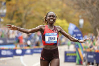 Sharon Lokedi, of Kenya, crosses the finish line first in the women's division of the New York City Marathon, Sunday, Nov. 6, 2022, in New York. (AP Photo/Jason DeCrow)