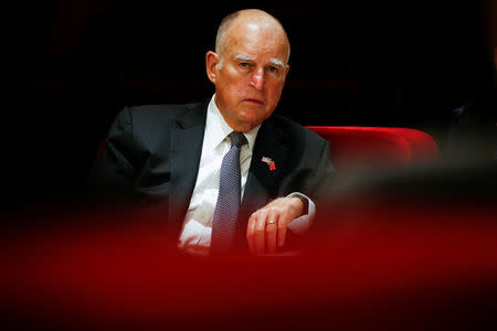 FILE PHOTO: California Governor Jerry Brown attends the International Forum on Electric Vehicle Pilot Cities and Industrial Development in Beijing, China June 6, 2017. REUTERS/Thomas Peter/File Photo