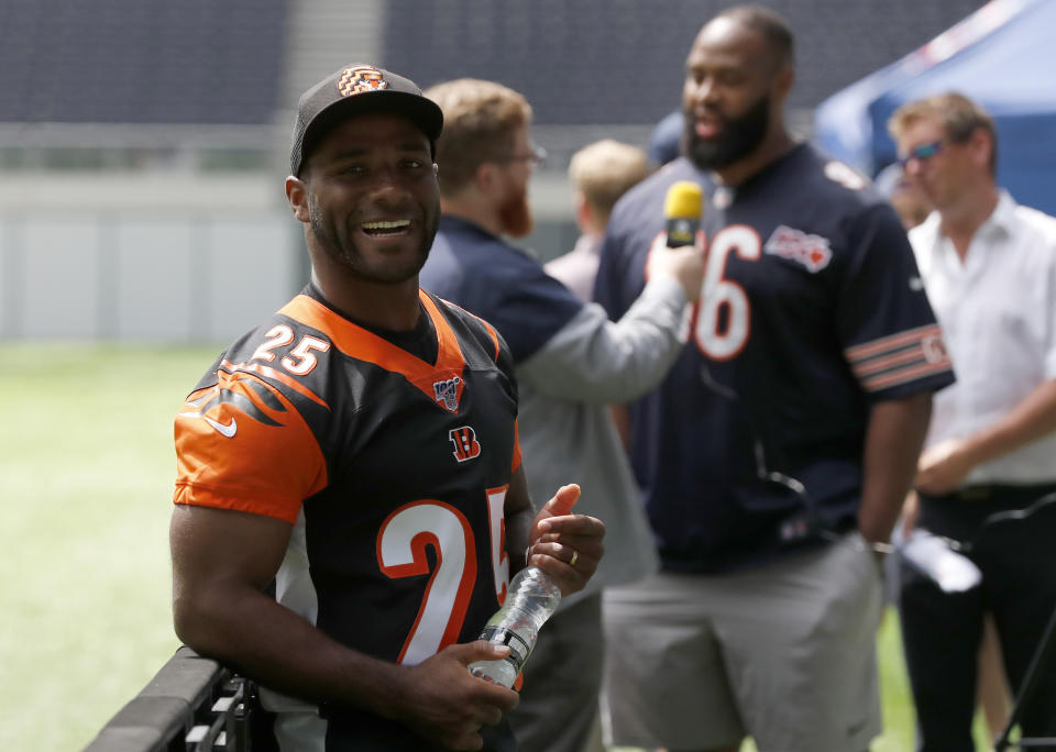 NFL Player Giovani Bernard of the Cincinnati Bengals pauses before an interview during the final tournament for the UK's NFL Flag Championship, featuring qualifying teams from around the country, at the Tottenham Hotspur Stadium in London, Wednesday, July 3, 2019. The new stadium will host its first two NFL London Games later this year when the Chicago Bears face the Oakland Raiders and the Carolina Panthers take on the Tampa Bay Buccaneers. (AP Photo/Frank Augstein)