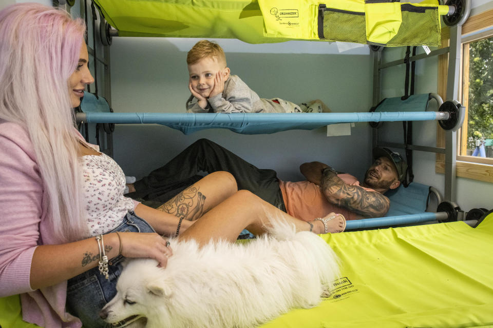 These pictures show a family of four who paid £500 to spent the night in a PLAYHOUSE - that was posted on Airbnb as a joke. Ollie and Kady Hammond had a 'mini break' on Saturday eve in the child's toy house - with their kids Beau, five, and Brooke, ten. They snapped up the booking after it was posted as a prank by Jason Kneen, 49. He built the 8ft (2.4m) by 6ft (1.8m) structure in his garden during lockdown. The dad-of-five then advertised it on the popular travel website for a laugh - but didn't actually think anyone would stump up to stay.