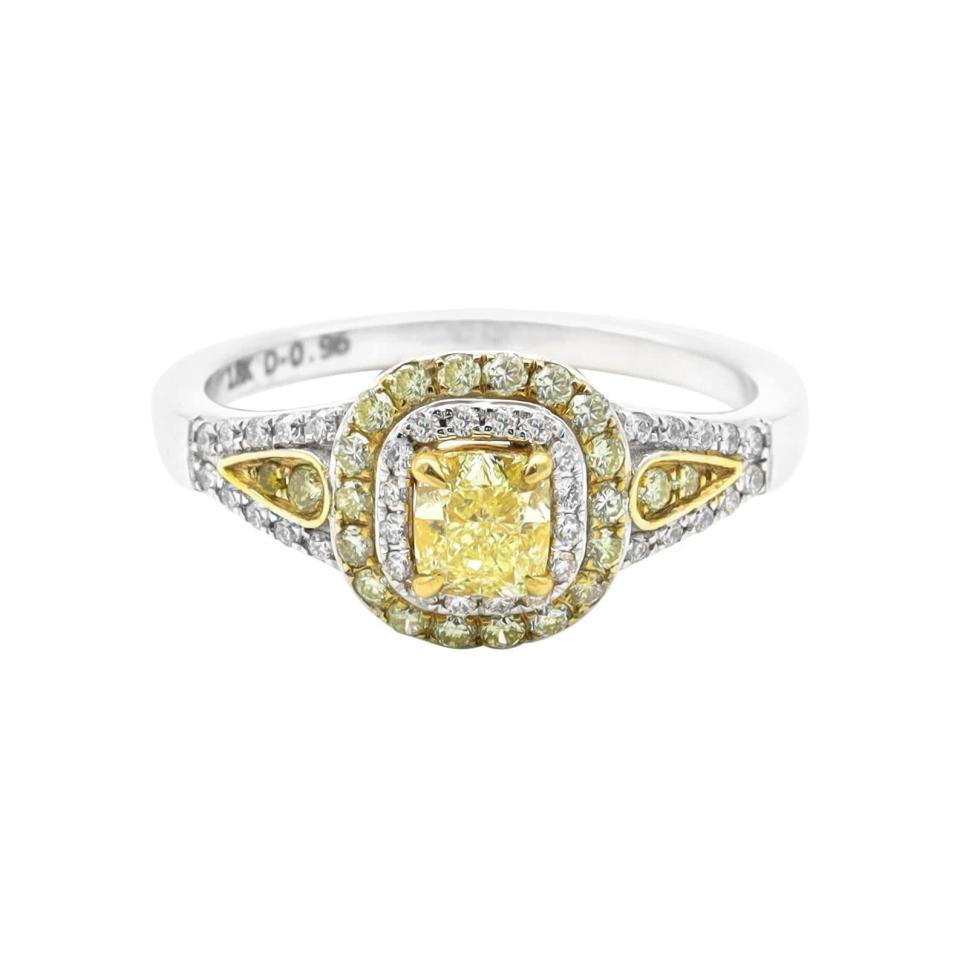<p><span>18 Karat Gold Fancy Yellow Diamond and White Diamond Double Cluster Ring</span> ($2,690)</p>