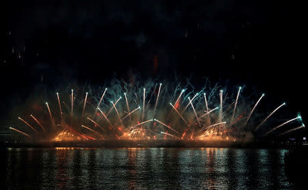 Fireworks explode along the Neva River, during the Scarlet Sails festivities marking school graduation, in St. Petersburg, Russia,June 24, 2018. REUTERS/Henry Romero