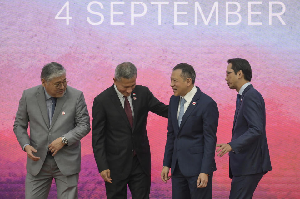 From left to right, Philippines' Foreign Secretary Enrique Manalo, Singapore's Foreign Minister Vivian Balakrishnan, Thailand's Permanent Secretary to the Ministry of Foreign Affairs Sarun Charoensuwan and Vietnam's Deputy Foreign Minister Do Hung Viet take their positions on the stage for a family photo during the Association of Southeast Asian Nations (ASEAN) Foreign Ministers' Meeting ahead of the ASEAN Summit, at the ASEAN Secretariat in Jakarta, Indonesia, Monday, Sept. 4, 2023. (Bay Ismoyo/Pool Photo via AP)