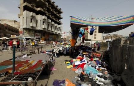 Clothes are scattered at the site of a suicide bomb attack in Baghdad, Iraq, September 17, 2015. REUTERS/Ahmed Saad