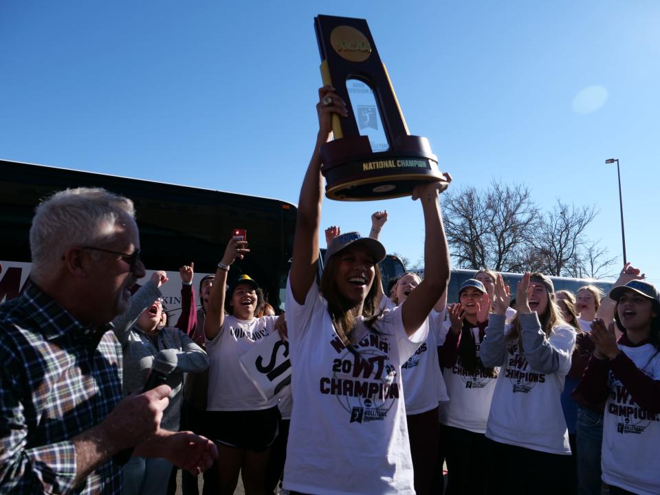 WT's Kayla Elliot hoists up the National Volleyball Championship trophy on Monday, Dec. 5, 2022 in Canyon