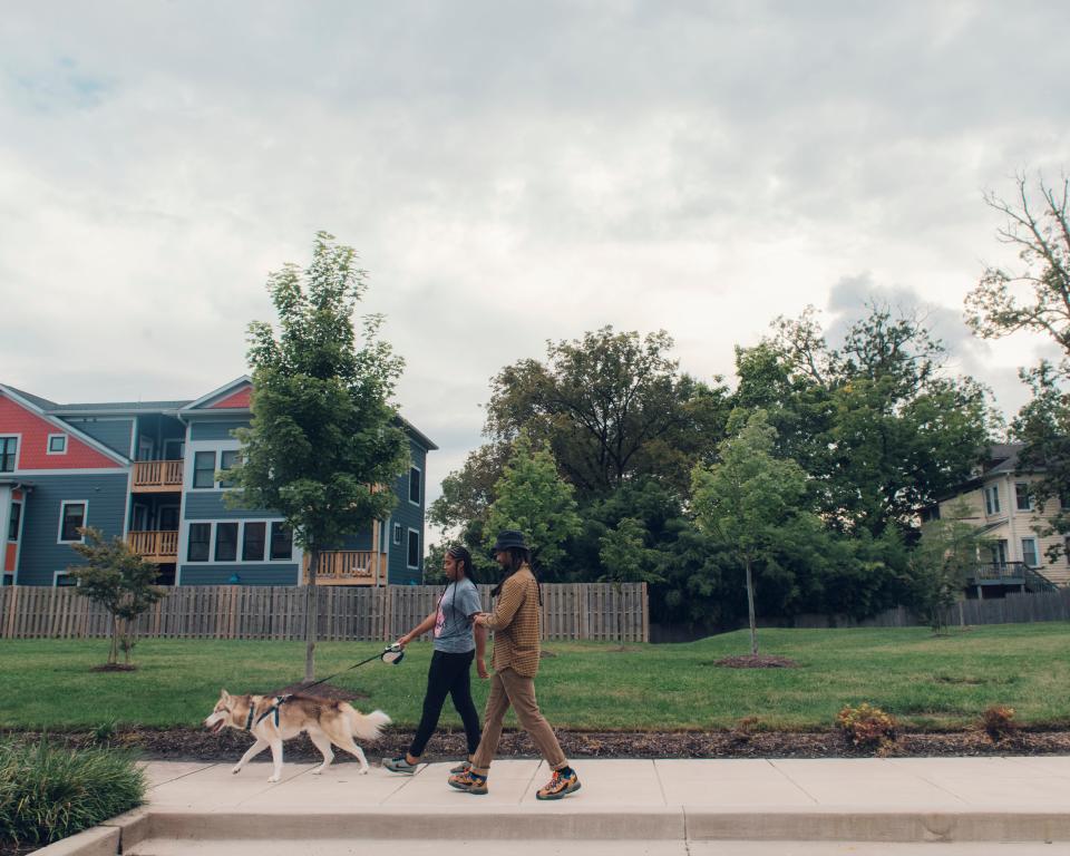 Ayanna Brooks, Joseph Burroughs and Neptune in the Takoma neighborhood of Washington, D.C. In December 2018, Brooks and Burroughs were walking Neptune when a Takoma Park Police K9 attacked Brooks, biting her left leg. (Photo by Jared Soares for The Marshall Project)