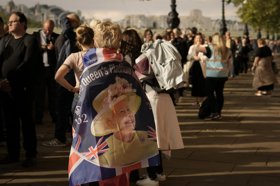 FILE - People wait in line to pay tribute to Queen Elizabeth II in central London, Sept. 15, 2022. (AP Photo/Vadim Ghirda, File)