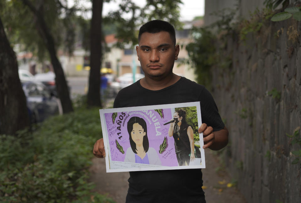 In this photo taken in San Salvador, El Salvador, on Wednesday, May 18, 2022, Jesús holds a photo of a drawing of his mother, Manuela, who was arrested in 2008 on suspicion of breaching El Salvador’s abortion law after she suffered an obstetric emergency. His mother died from cancer in 2010 while serving a 30-year sentence for aggravated homicide. The Inter-American Court of Human Rights recently ruled that the Salvadoran government had violated Manuela's rights and ordered it to pay damages to her two sons who were left orphaned. (AP Photo/Jessie Wardarski)