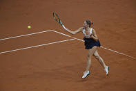 Ukraine's Marta Kostyuk returns the ball against Czech Republic's Vondrousova during their semifinal match of the WTA Tour against, in Stuttgart, Germany, Saturday April 20, 2024. (Marijan Murat/dpa via AP)