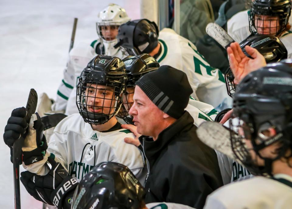 Dartmouth head coach Mike Cappello talks with JC Frates prior to the start of the overtime period on Saturday afternoon. Frates would score the game-winning goal for Dartmouth.