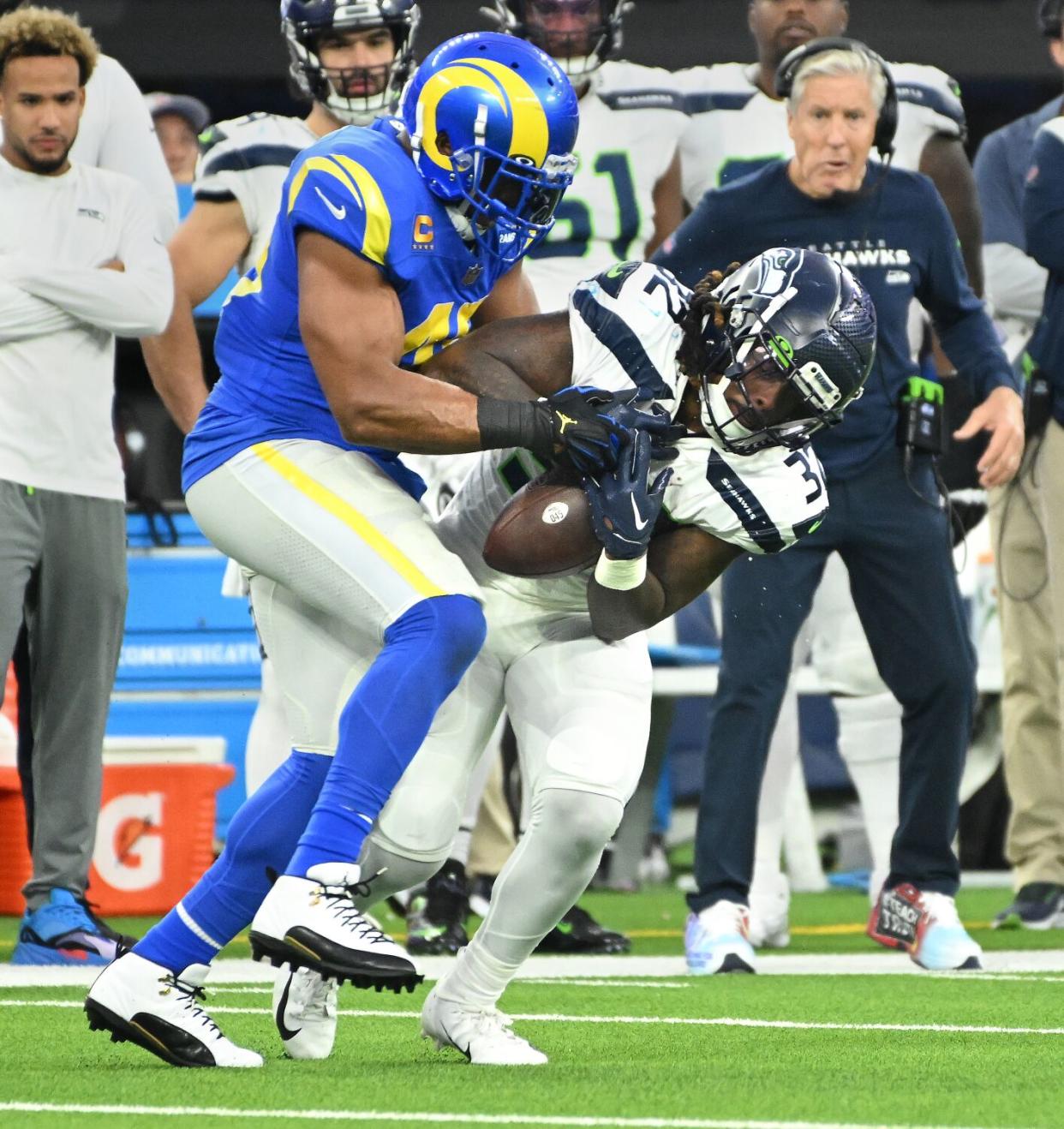 Rams linebacker Bobby Wagner steals the ball from Seattle's Tony Jones Jr. in the third quarter for an interception.