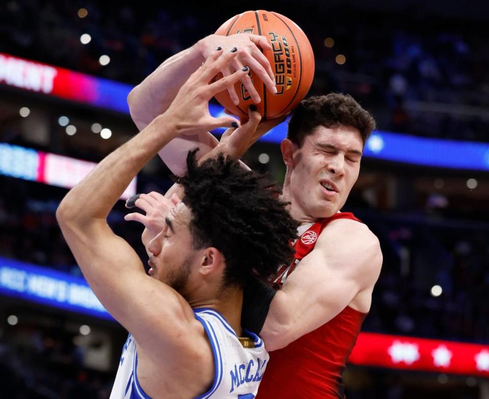 N.C. State’s Michael O’Connell (12) is fouled by Duke’s Jared McCain (0) during the first half of N.C. State’s game against Duke in the quarterfinal round of the 2024 ACC Men’s Basketball Tournament at Capital One Arena in Washington, D.C., Thursday, March 14, 2024. Ethan Hyman/ehyman@newsobserver.com
