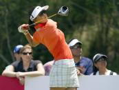 Michelle Wie watches the flight off her golf ball after hitting off the fifth tee in the final round of the LPGA LOTTE Championship golf tournament at Ko Olina Golf Club, Saturday, April 19, 2014, in Kapolei, Hawaii. (AP Photo/Eugene Tanner)