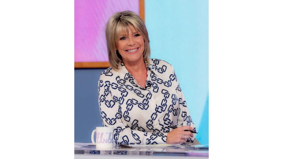 Ruth Langsford smiling in a chain print shirt on Loose Women