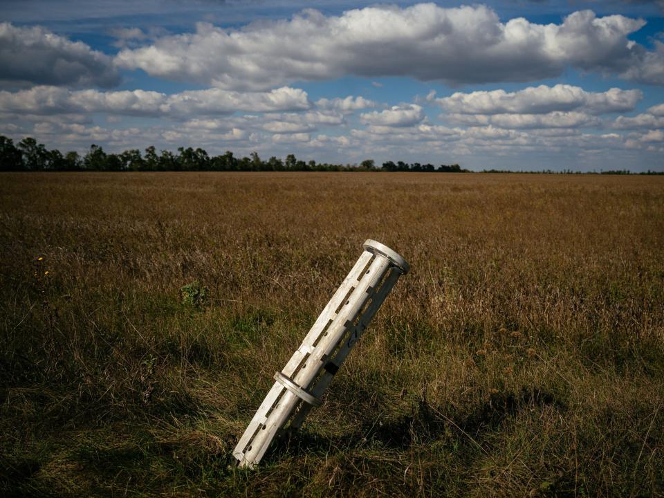 This photograph taken on October 7, 2022 shows a Russian rocket sticks out a ground near the village of Ukrainka in a part of Southern Ukraine.