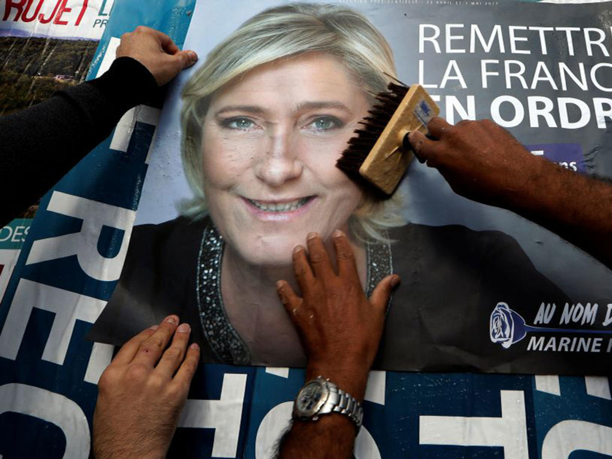 A billboard poster for French National Front leader Marine Le Pen in Antibes. After Sunday's vote, she will face a run-off with Emmanuel Macron on 7 May: Reuters