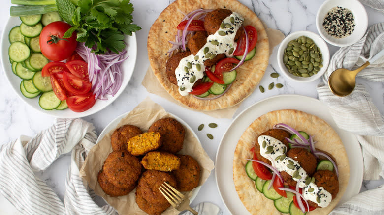 pumpkin falafels with pita and toppings