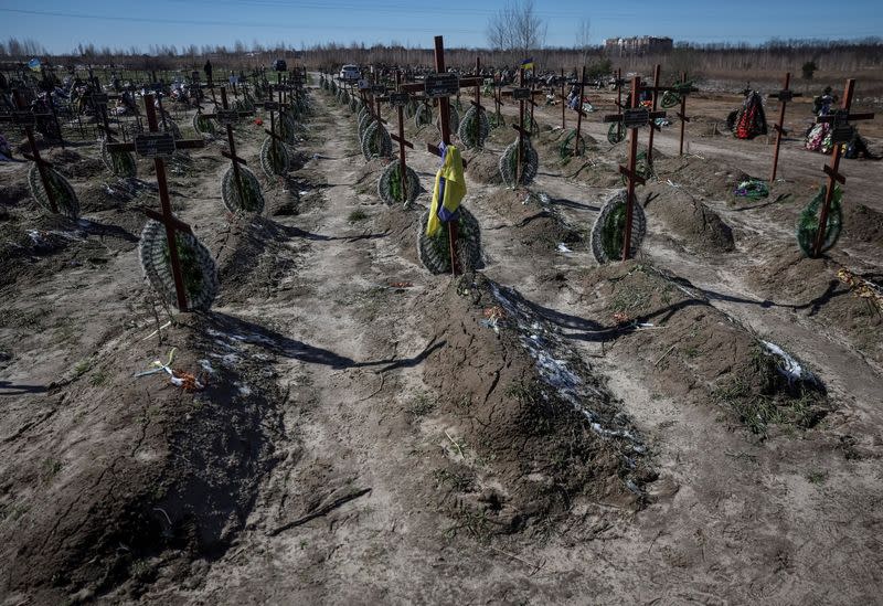 Graves of unidentified people killed by Russian soldiers during occupation of the Bucha town, are seen at the town's cemetery outside Kyiv