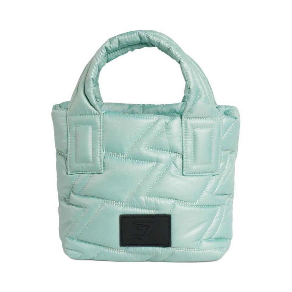 <p><a href="https://go.redirectingat.com?id=74968X1596630&url=https%3A%2F%2Fus.shop.gymshark.com%2Fproducts%2Fgymshark-quilted-mini-tote-frost-teal-ss23&sref=https%3A%2F%2Fwww.elle.com%2Ffashion%2Fshopping%2Fg44640132%2Fbest-quilted-tote-bags%2F" rel="nofollow noopener" target="_blank" data-ylk="slk:Shop Now;elm:context_link;itc:0;sec:content-canvas" class="link ">Shop Now</a></p><p>Quilted Mini Tote</p><p>$50.00</p><p>gymshark.com</p><span class="copyright">Courtesy</span>