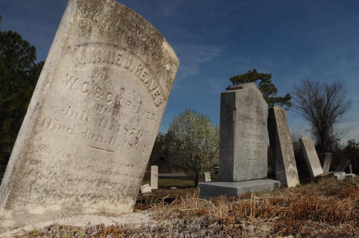 Gravestones in the Flemington-Oak Grove Cemetery, where paupers previously were buried. The cemetery, closed to burials in 1992, is where remains from the former Oak Grove Cemetery in Wilmington allegedly were relocated to in the 1960s. Some say only the markers were moved. KEN BLEVINS/STARNEWS