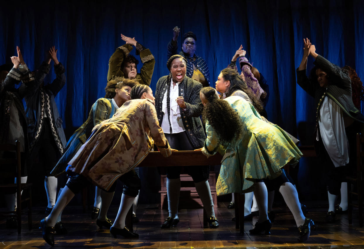 Crystal Lucas-Perry, center, as John Adams in "1776," in which the performers identify as female, transgender and nonbinary, at the American Airlines Theater in New York, Sept. 15, 2022.