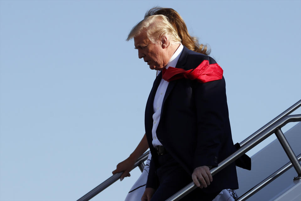 President Donald Trump and first Lady Melania Trump step off Air Force One upon arrival at Ellsworth Air Force Base, S.D., Friday, July 3, 2020. Trump is en route to Mount Rushmore National Memorial. (AP Photo/Alex Brandon)